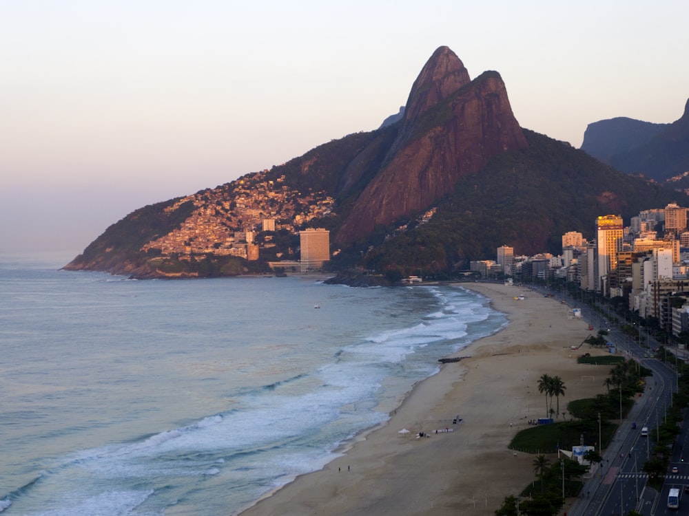 a view of a beach with a mountain in the background