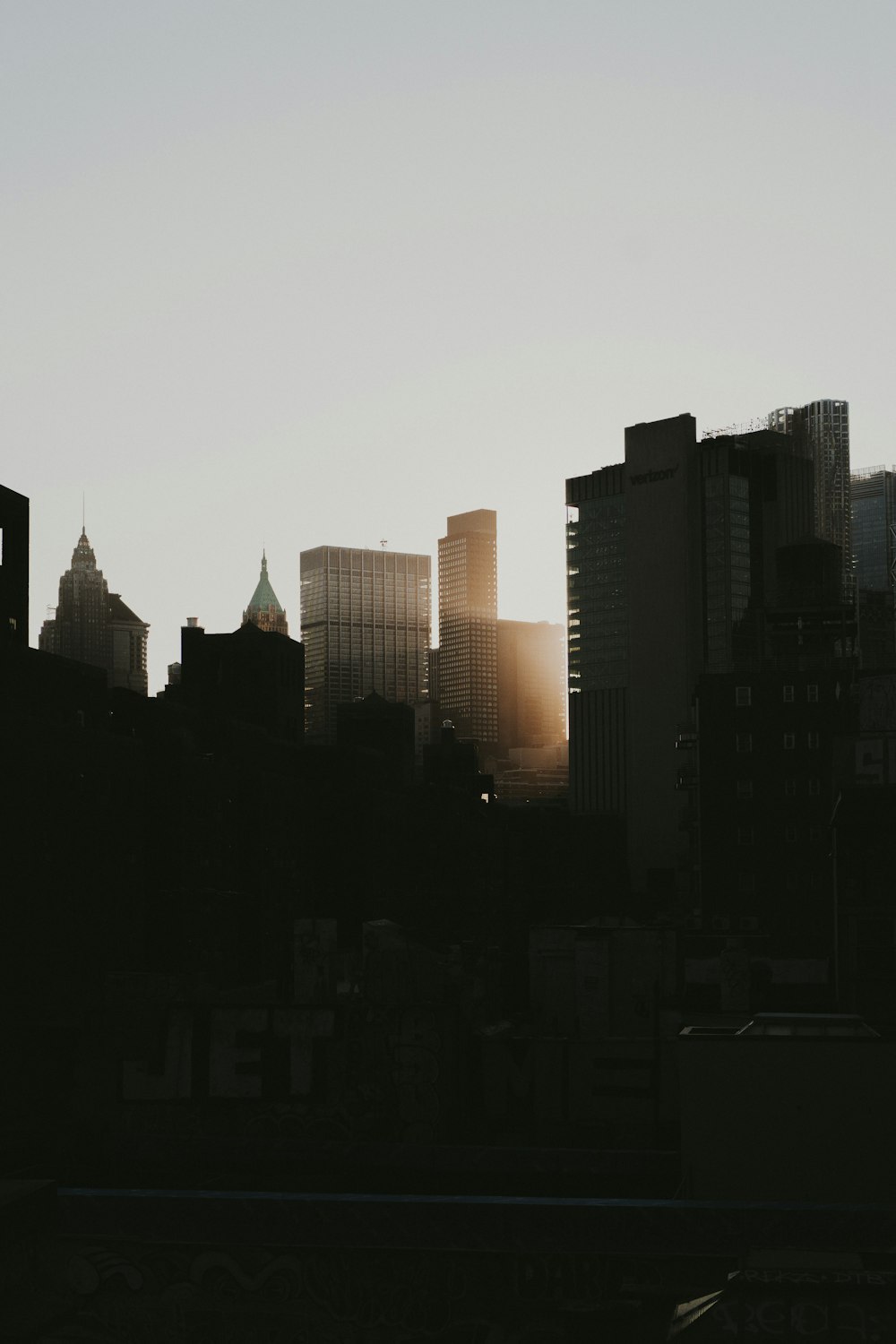 a view of a city skyline at sunset