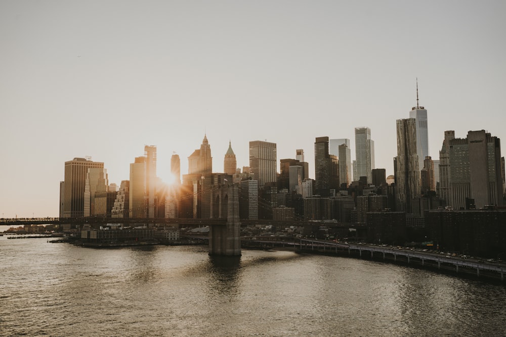 the sun is setting over a large city