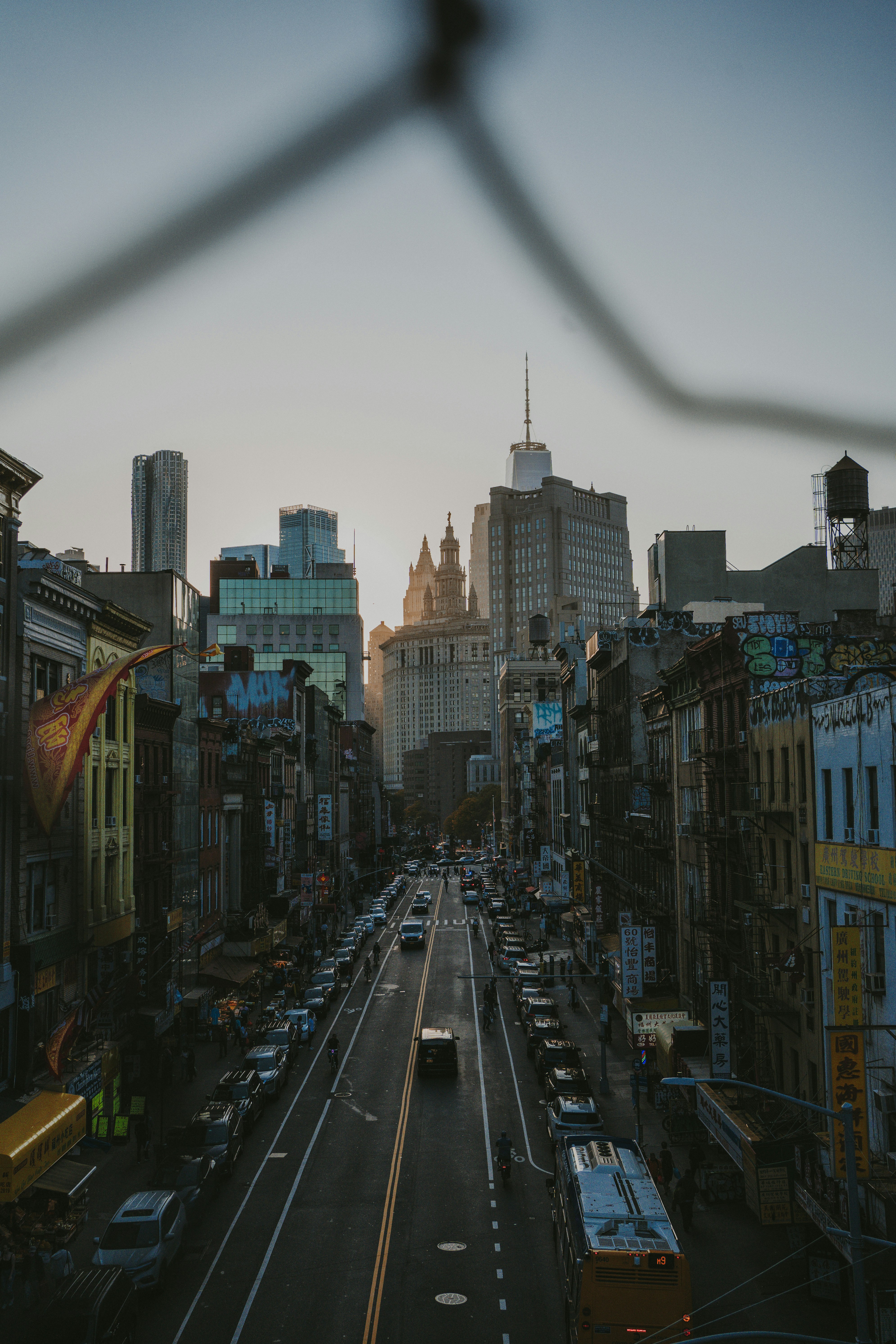 A city street filled with lots of traffic next to tall buildings photo ...