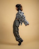 a woman in black and white shirt and pants