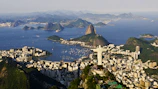 an aerial view of a city and a body of water