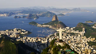 an aerial view of a city and a body of water