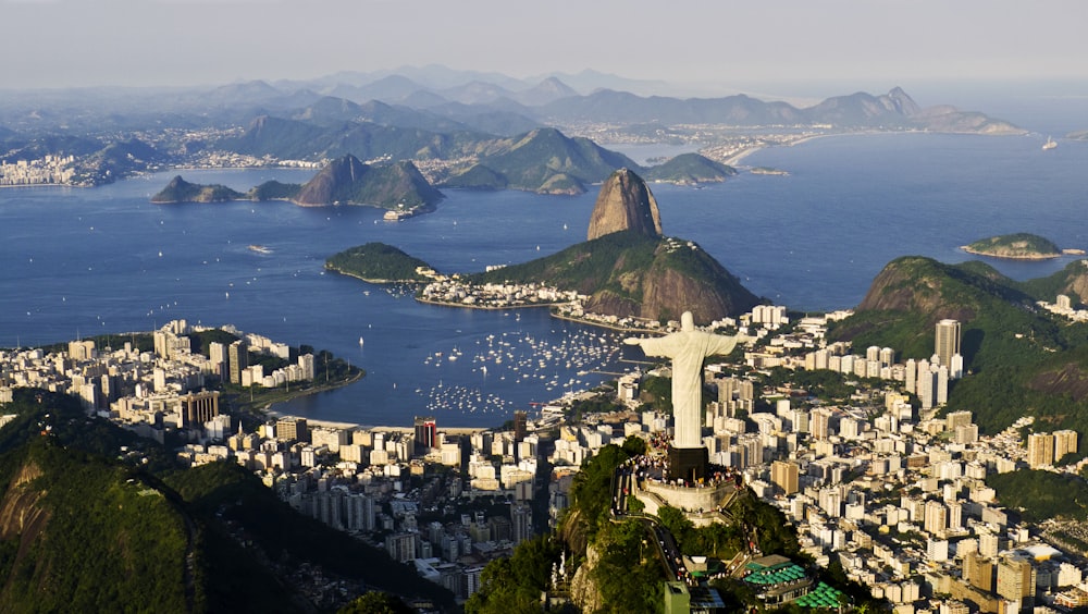 an aerial view of a city and a body of water