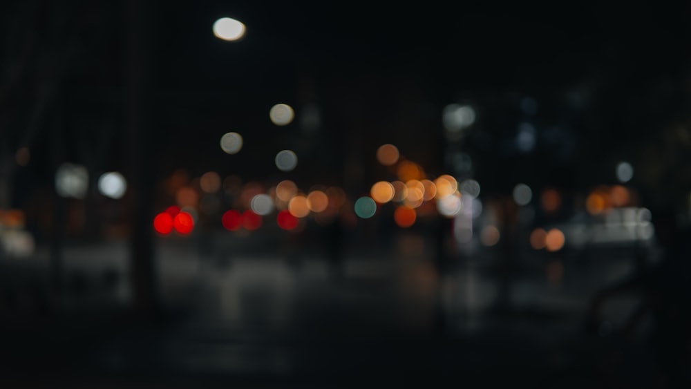 a blurry photo of a city street at night