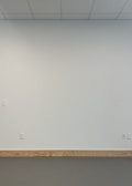 Different baseboard styles displayed against a wall.