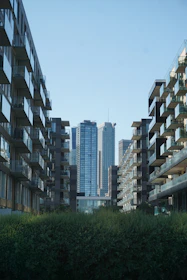Close-up view of a cleared commercial plot bordered by busy city streets and modern buildings.