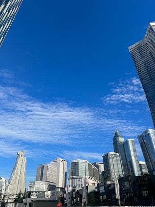 A modern city skyline showcasing various types of buildings and properties.