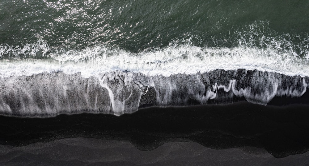 a black and white photo of the ocean waves