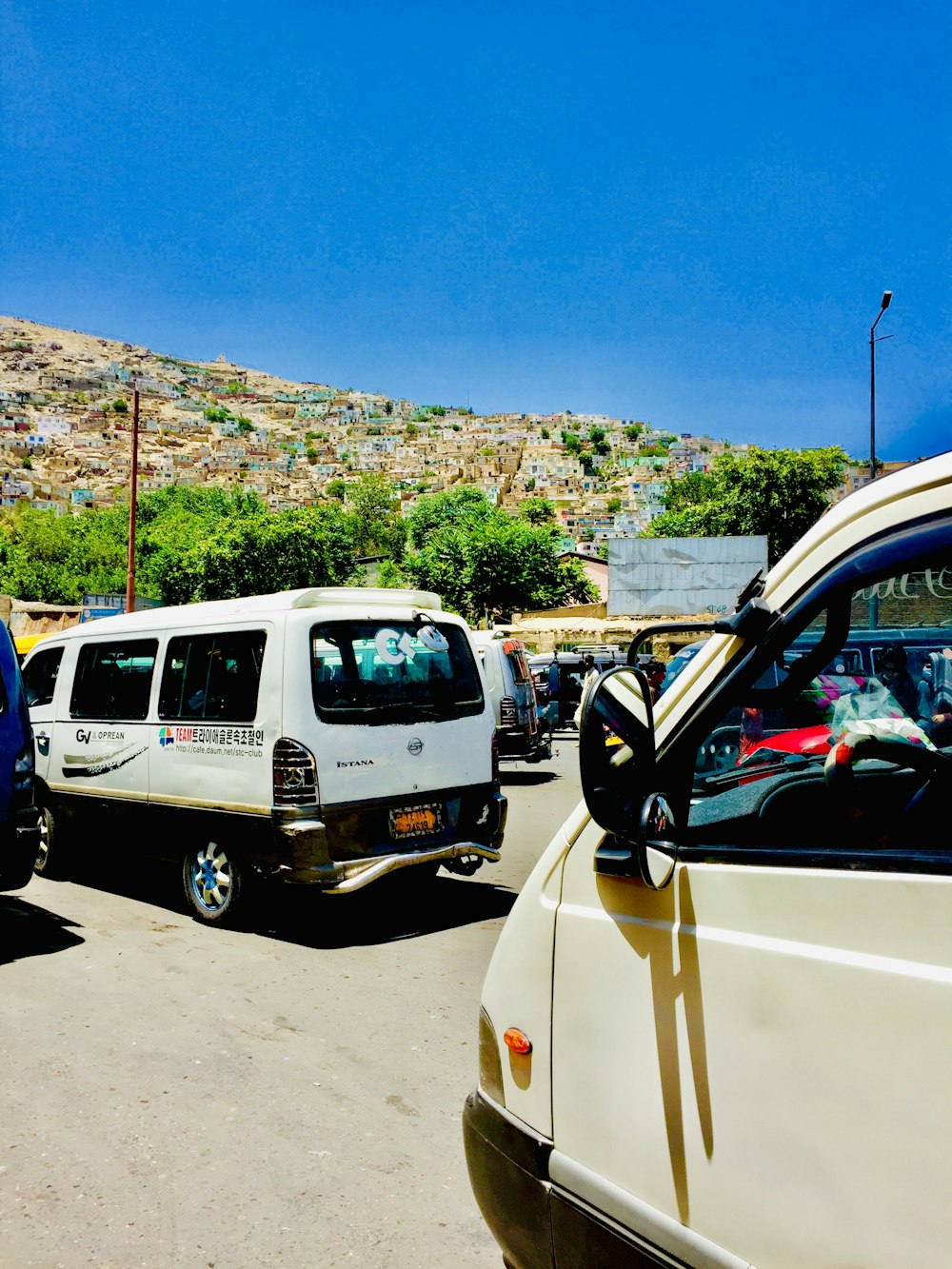 a group of cars parked in a parking lot