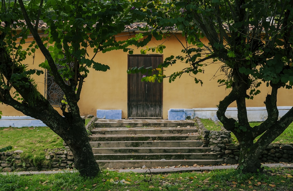 a yellow building with steps leading up to it