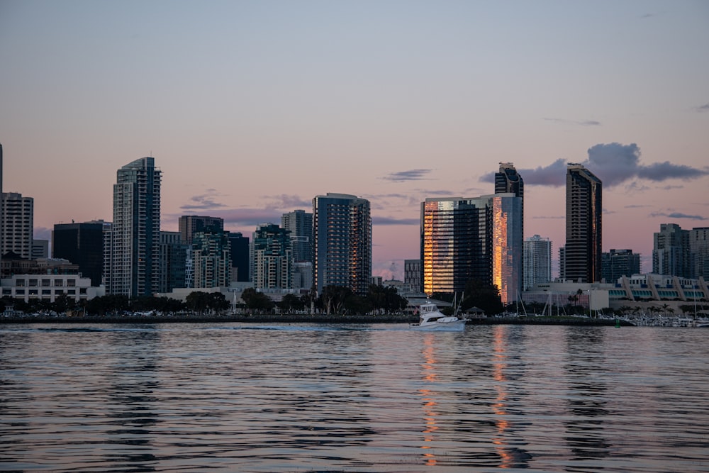 a large body of water with a city in the background