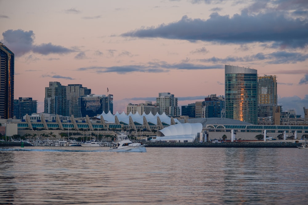 a large body of water with a city in the background