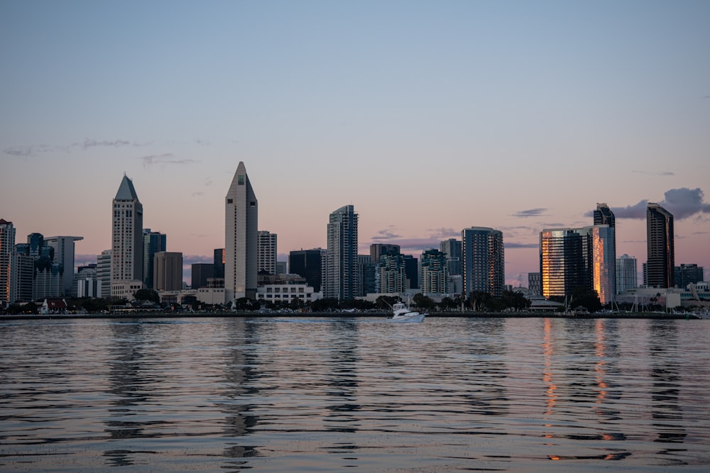 a large body of water with a city in the background