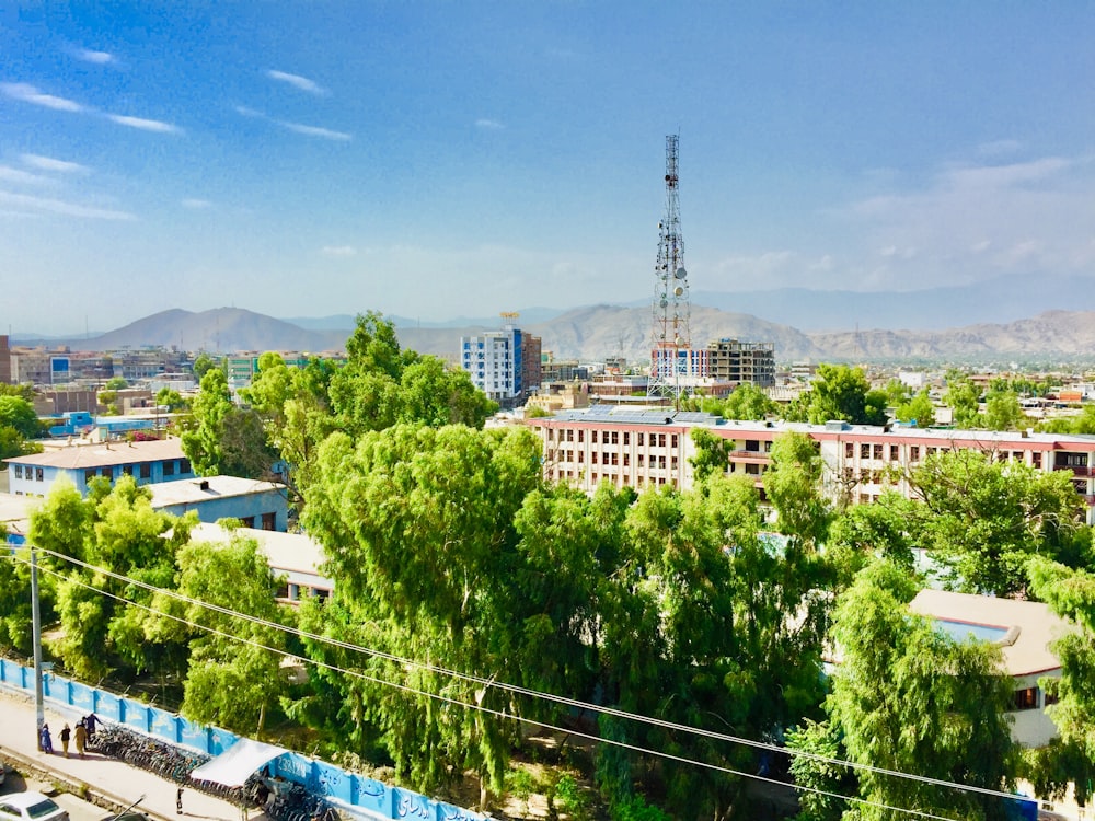 a view of a city with tall buildings and trees