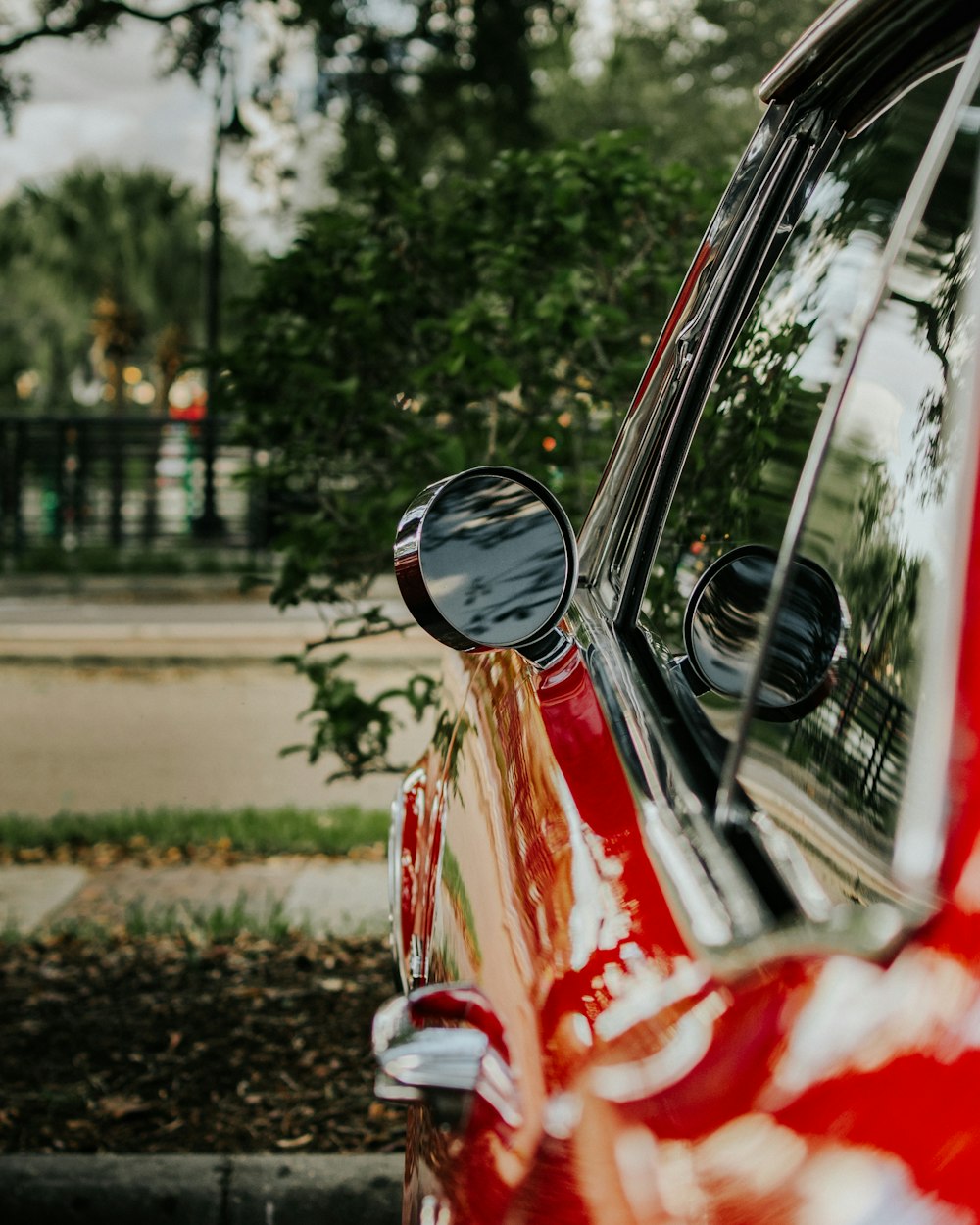 a red car parked on the side of the road