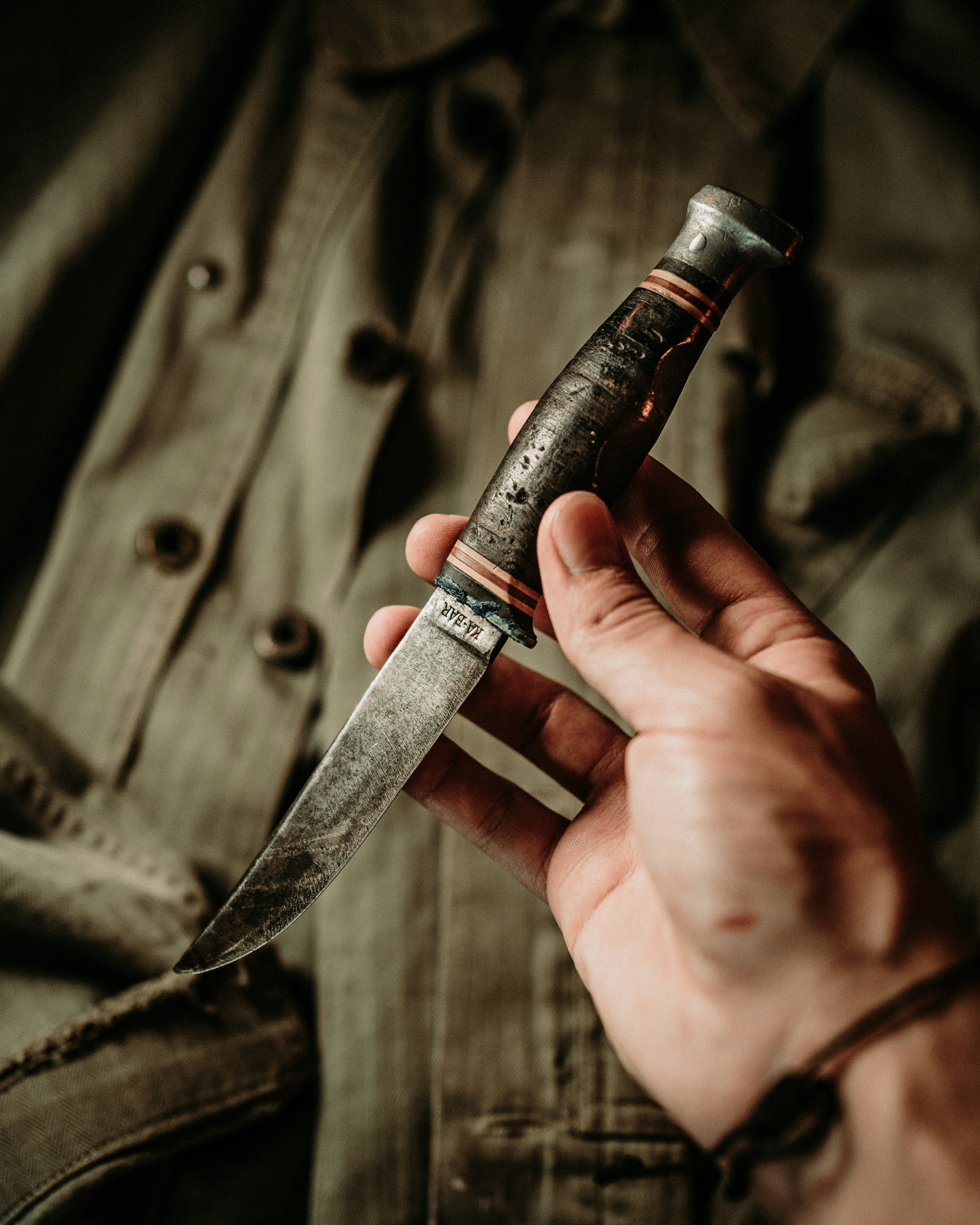 a person holding a knife in their hand