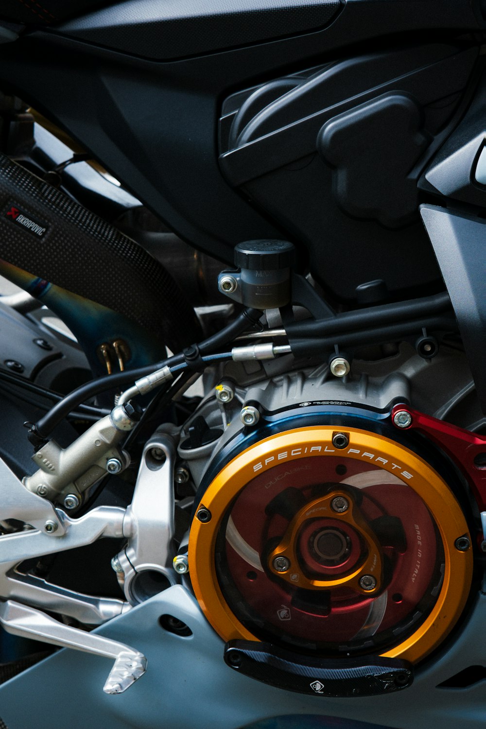 a close up of a motorcycle's engine and gear