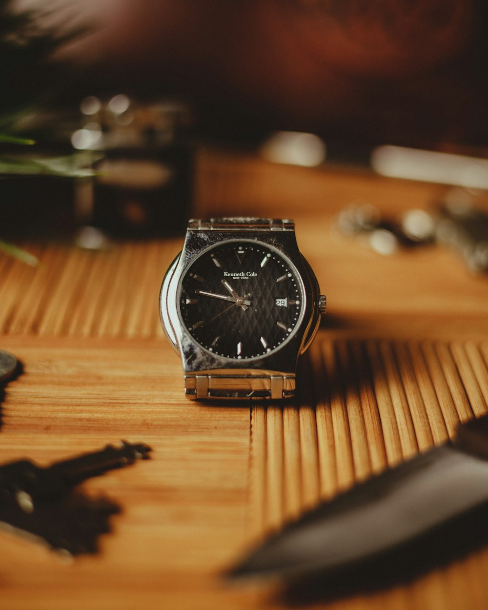 a watch sitting on top of a wooden table