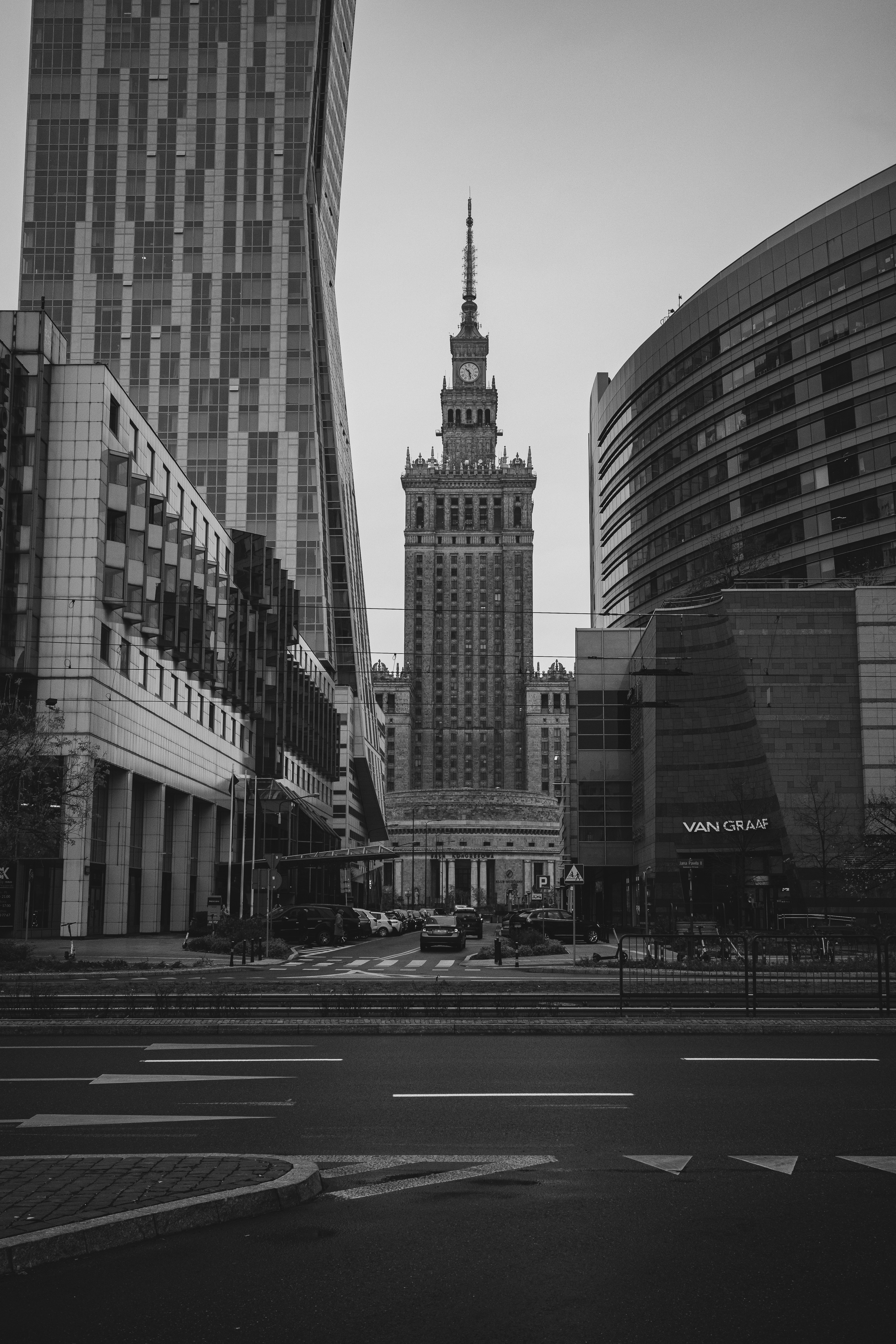 a black and white photo of a city with tall buildings