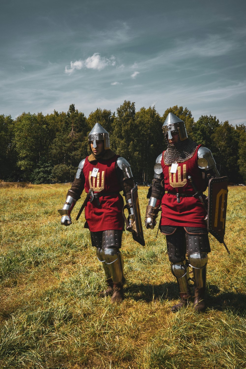 a couple of men in armor standing next to each other