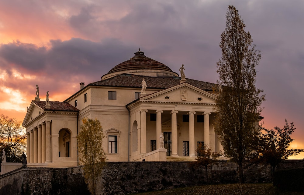 a large white building with columns and a dome