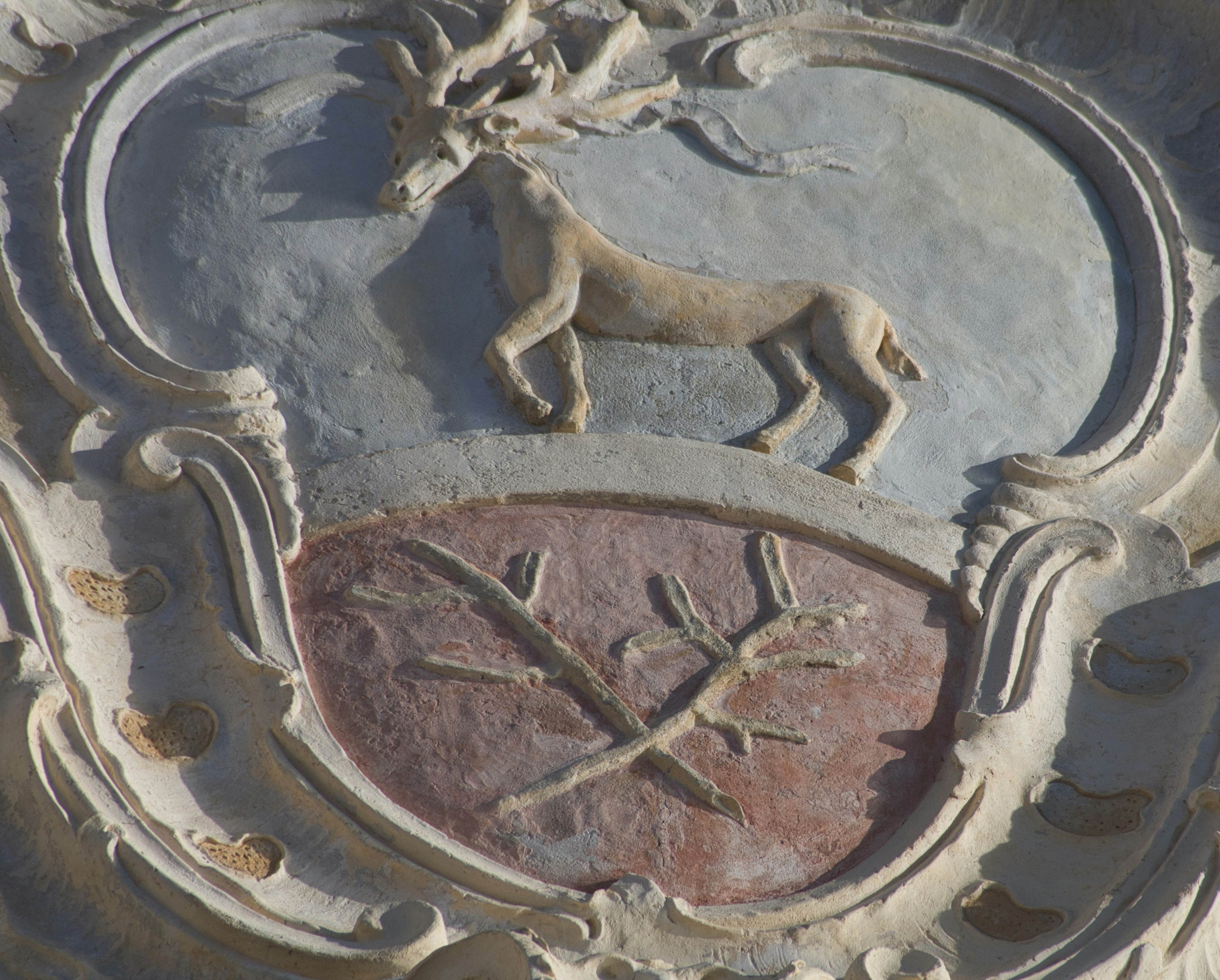a close up of a clock on the side of a building