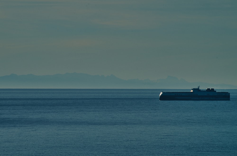 a large boat floating on top of a large body of water