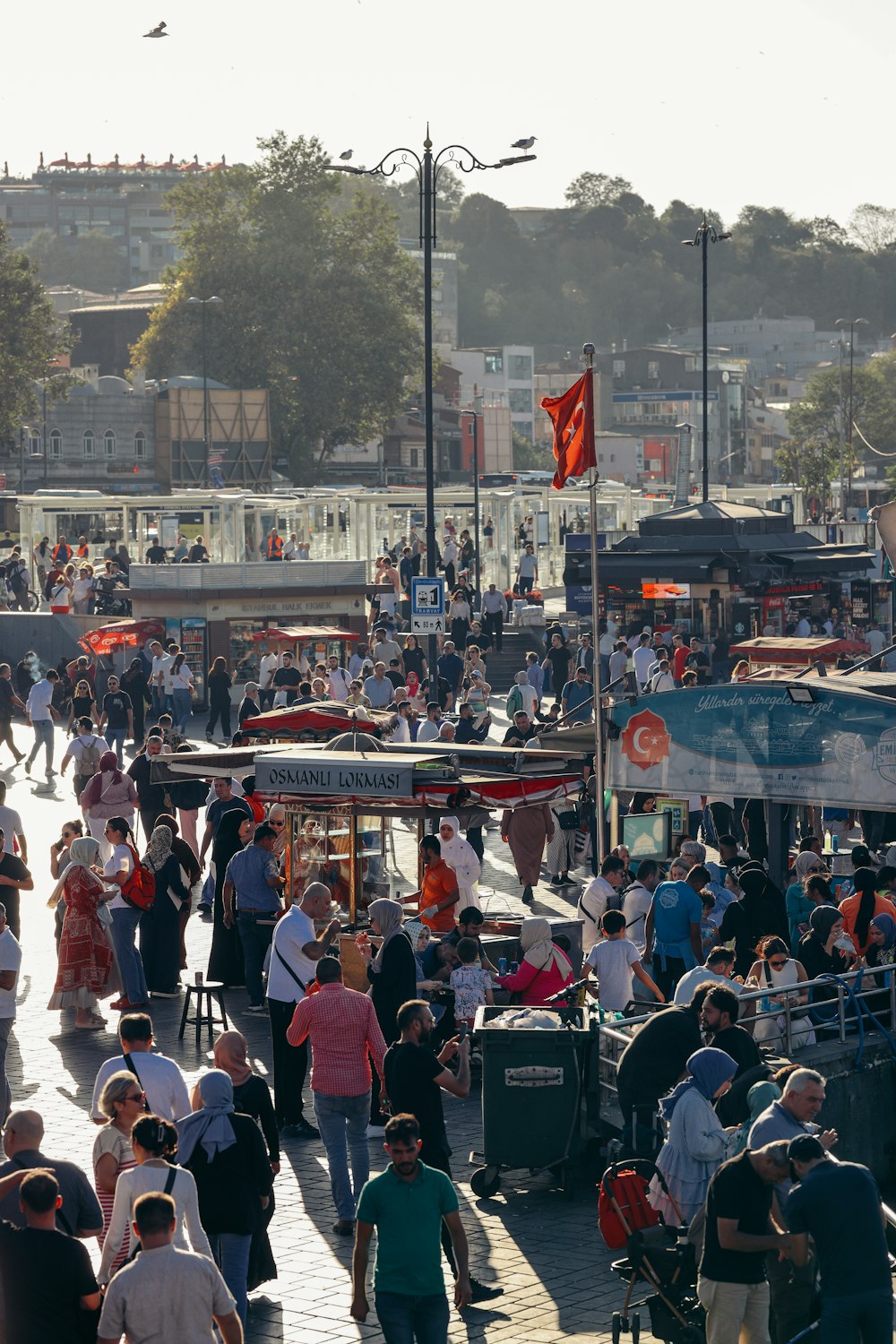 a crowd of people walking down a street