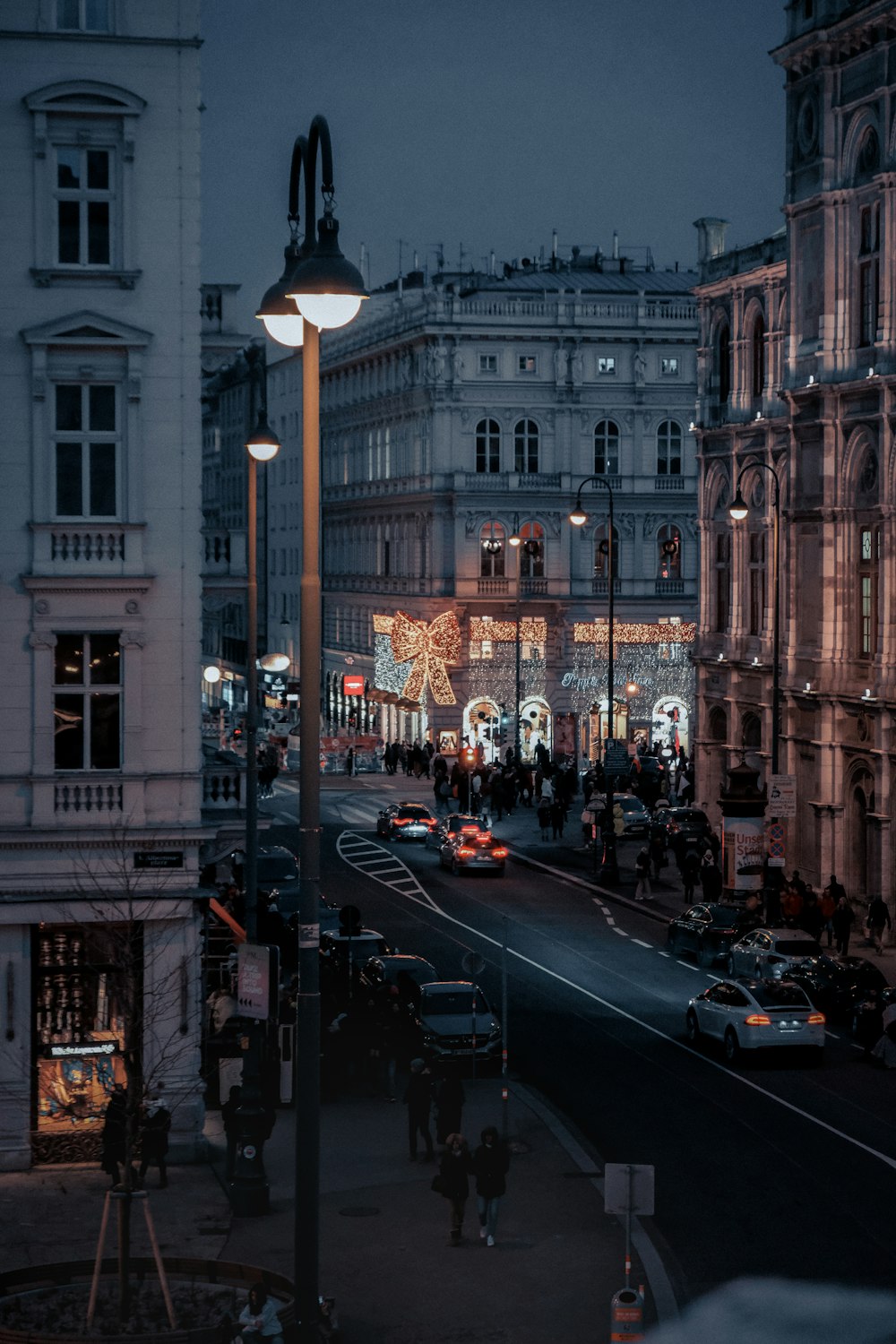 a city street with a lot of cars parked on the side of it