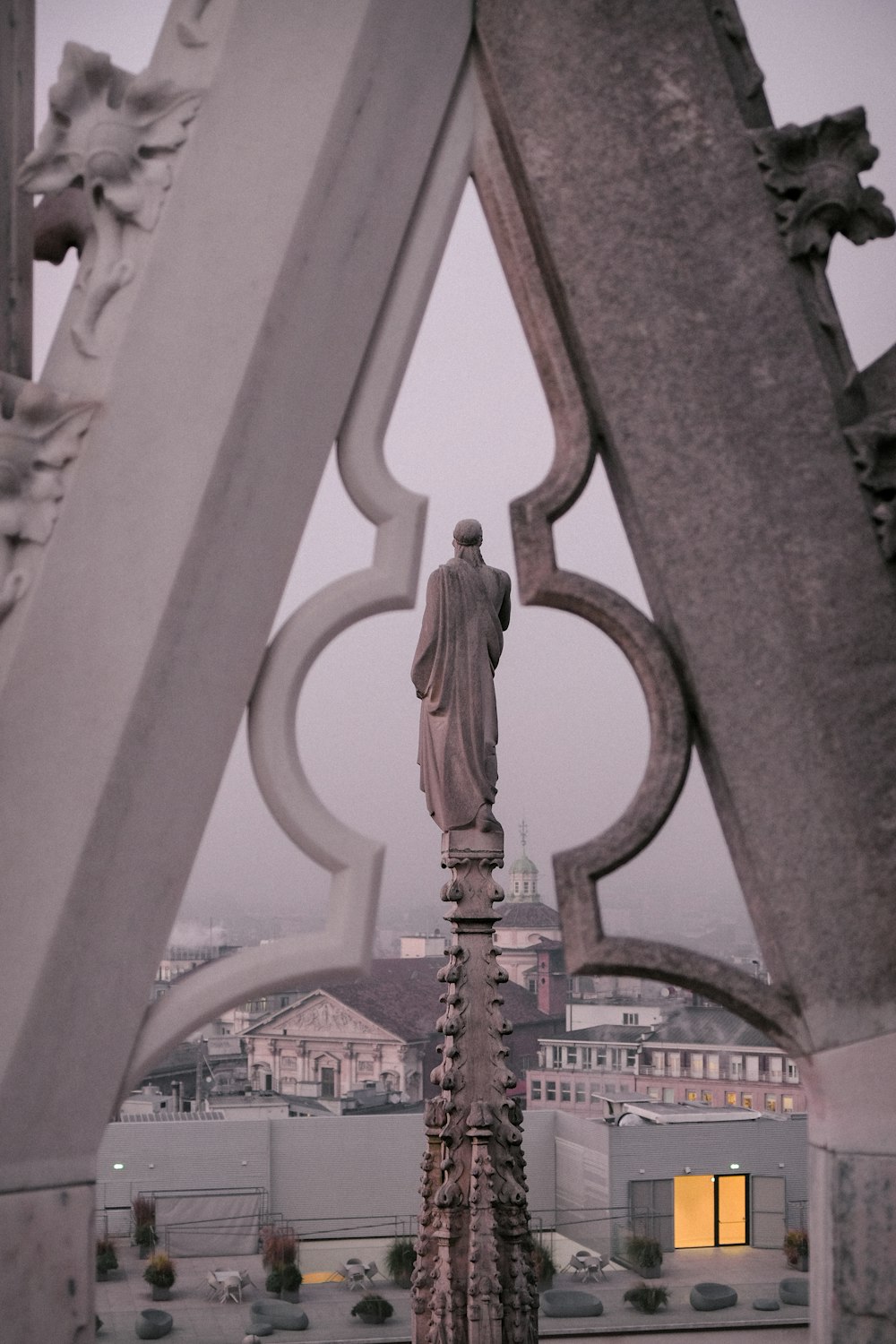 a statue of a man on top of a building