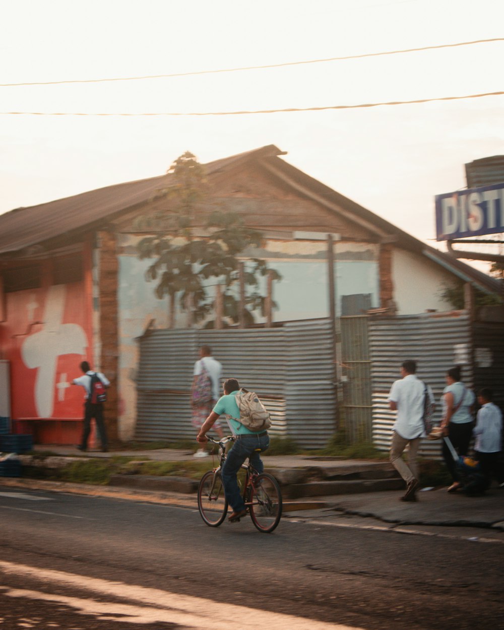 a person riding a bike down a street