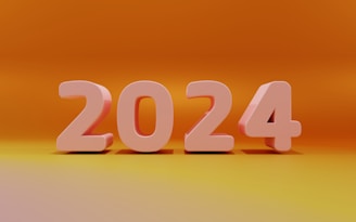 Large, three-dimensional pink numbers reading 2024 are centered against a smooth gradient background transitioning from yellow at the bottom to dark orange at the top.