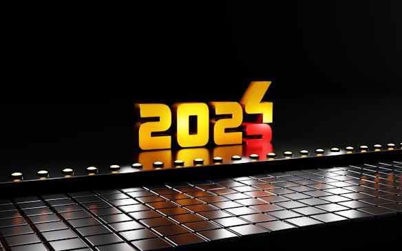 The image presents a futuristic scene with large, three-dimensional numbers '2024' made of gold and red material, illuminated against a dark background. These numbers are placed above a glossy, reflective surface made of black geometric tiles, with small lights lining the edge, adding a sense of depth.