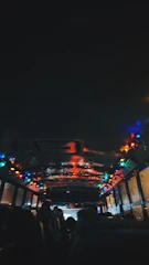 A vibrant party bus with colorful lights and happy passengers inside.
