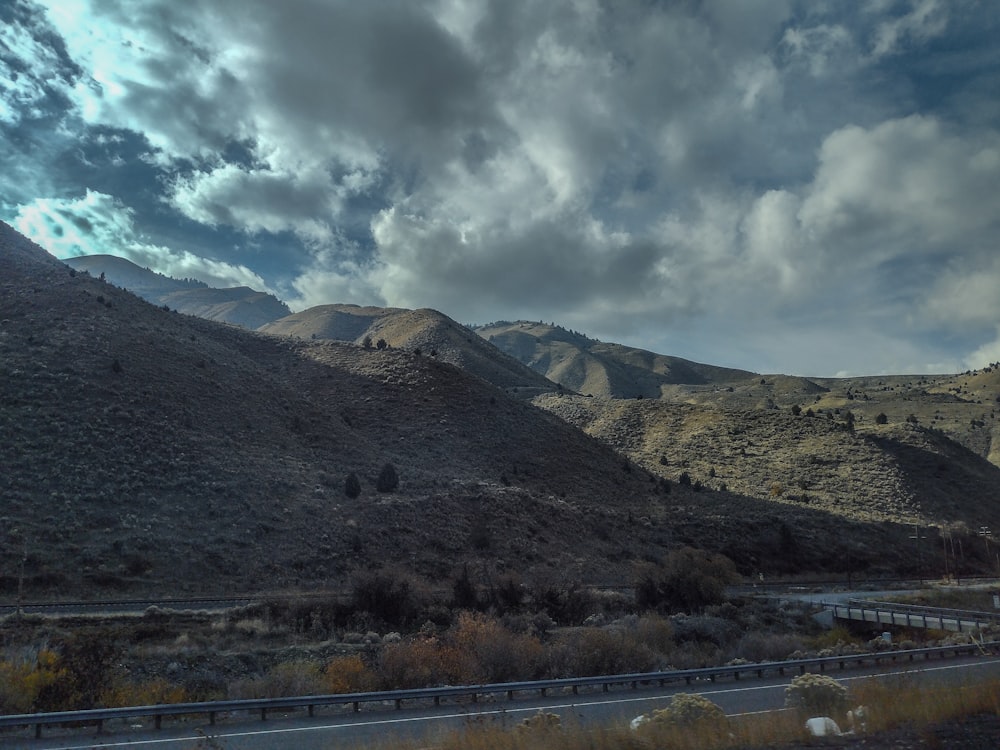 a scenic view of mountains and a highway