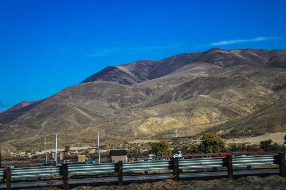 a highway with mountains in the background