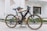 A happy customer riding a bicycle purchased from Anelise Ceretta Martins.