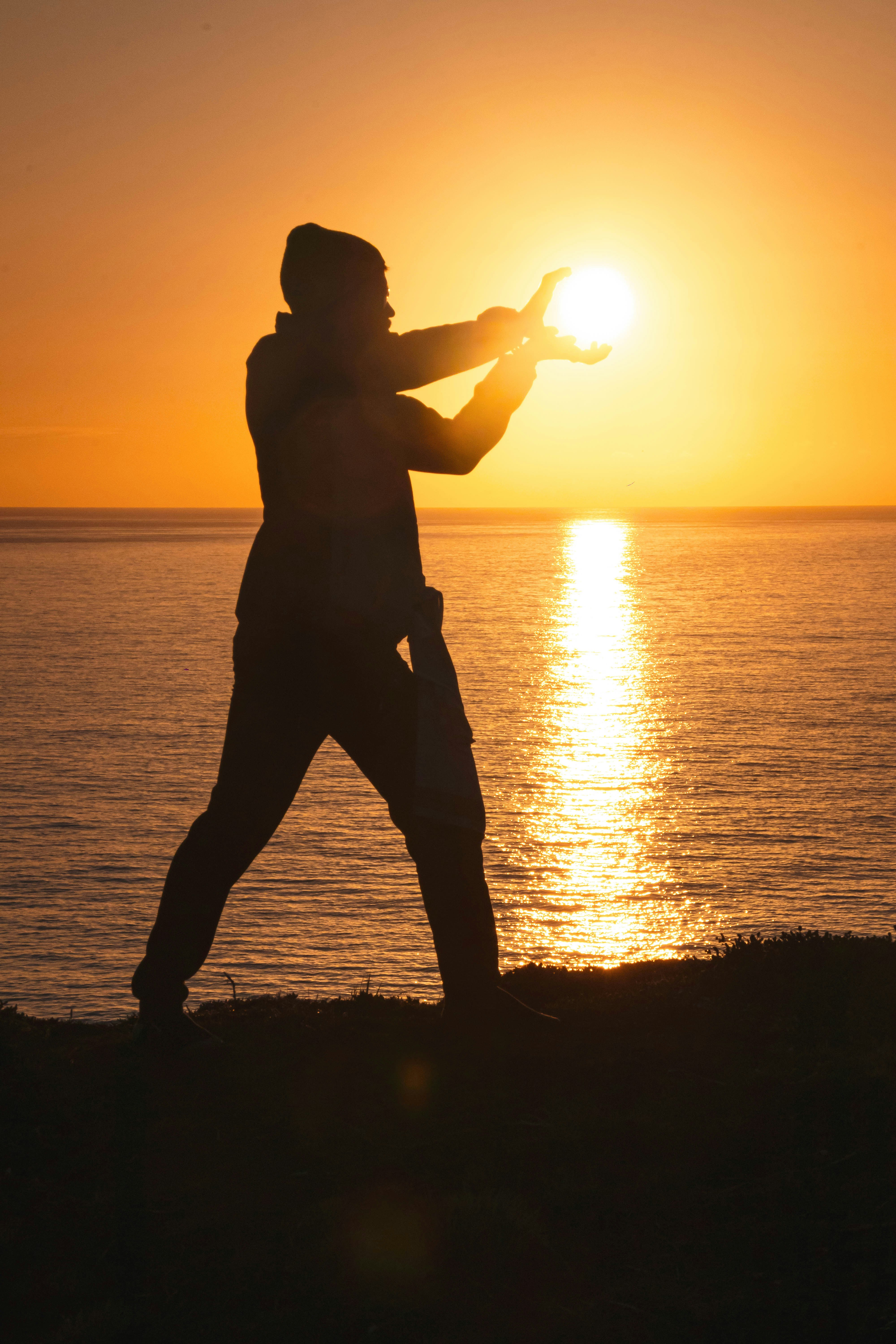 Tai Chi master practicing at sunset in Goa