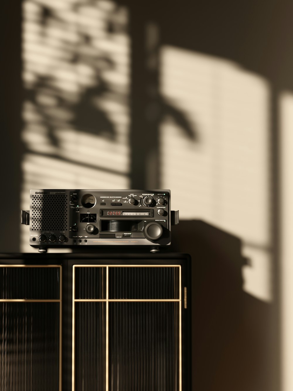 a radio sitting on top of a black cabinet