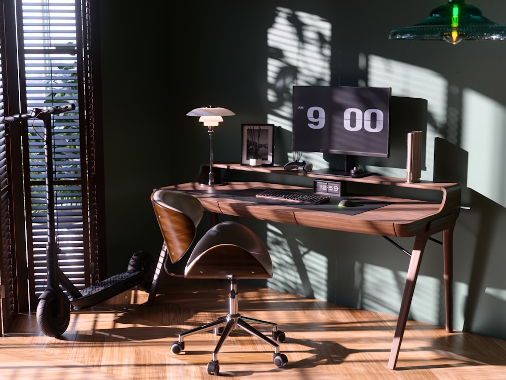 a desk with a computer on top of it