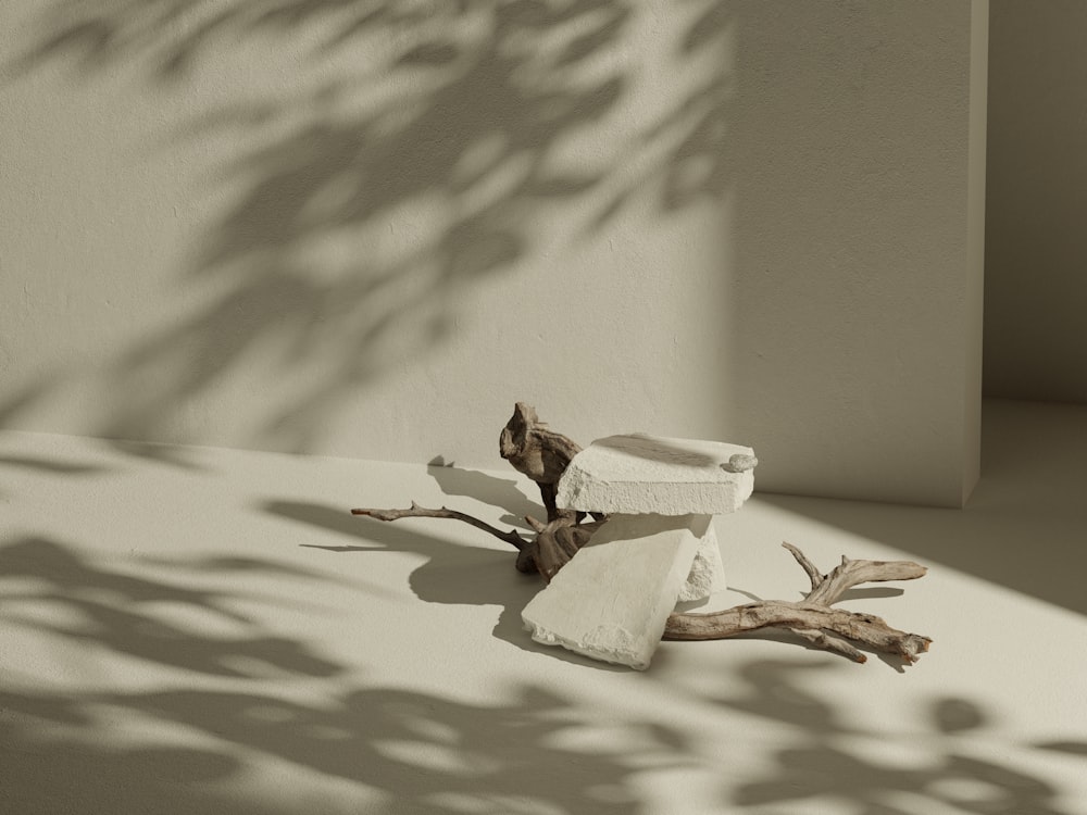 a piece of wood sitting on top of a floor next to a wall