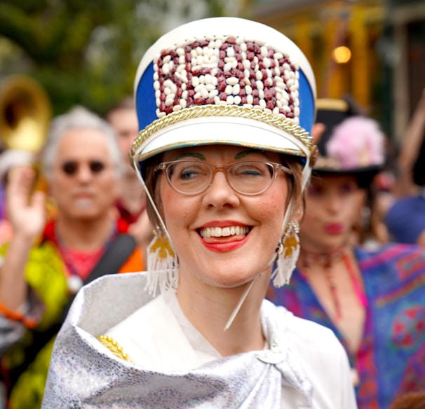 A happy customer wearing a patriotic hat at an outdoor festival, smiling broadly