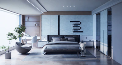 a bedroom with a large bed and a large window