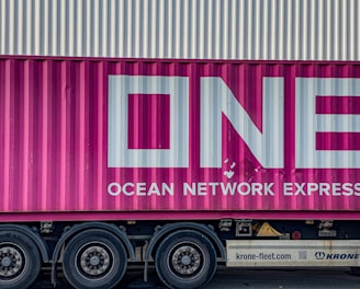 a pink truck with the word ocean network express painted on it