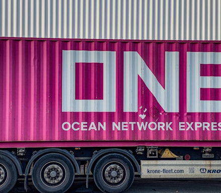 a pink truck with the word ocean network express painted on it