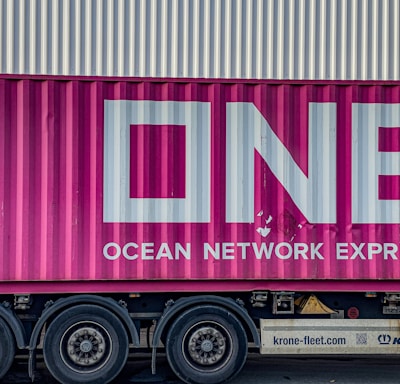 a pink truck with the word ocean network express painted on it