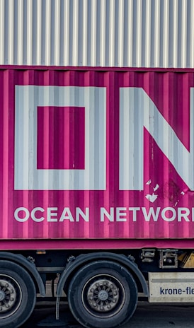 a pink truck with the word ocean network express painted on it