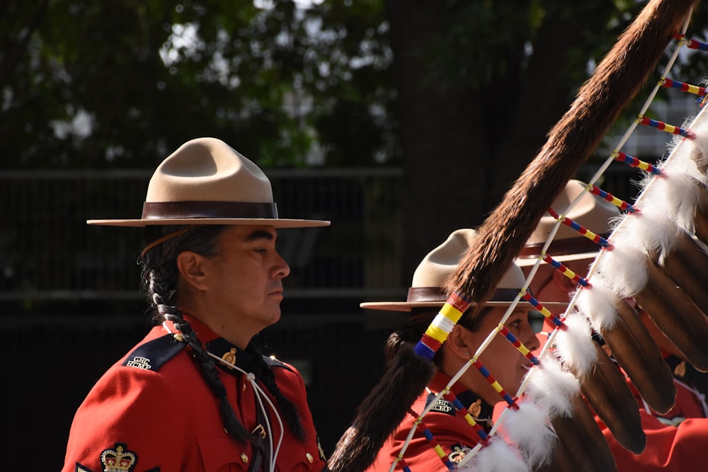 a man in a red uniform and a white hat