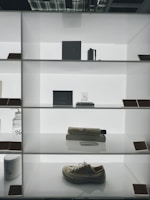 Minimalist display of pastel 3D printed home accessories arranged on a clean white surface.